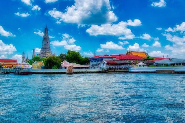 Wat Arun, the temple of dawn, by the Chao Phraya river in Bangkok, Thailand