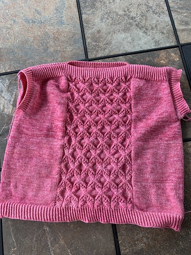 One side has 8 rounds of stockinette followed by 8 rounds of twisted rib while the other side has just the 8 rounds of twisted rib after I frogged the stockinette rounds.