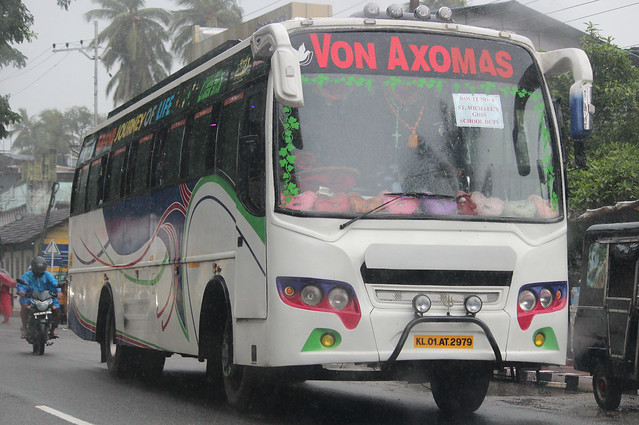 Kerala tour bus on school run, India