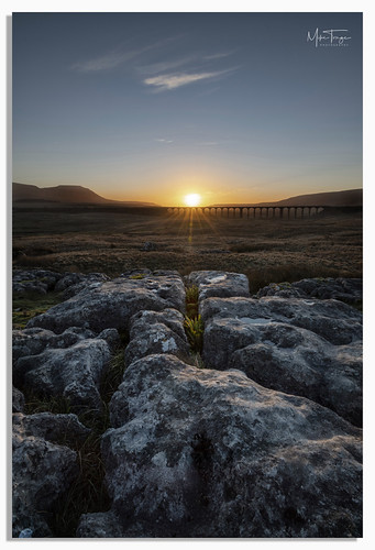 "Mind the gap". by miketonge, A sunset at Runscar with the Ribblehead Viaduct catching the last of the suns rays.

This is a delig