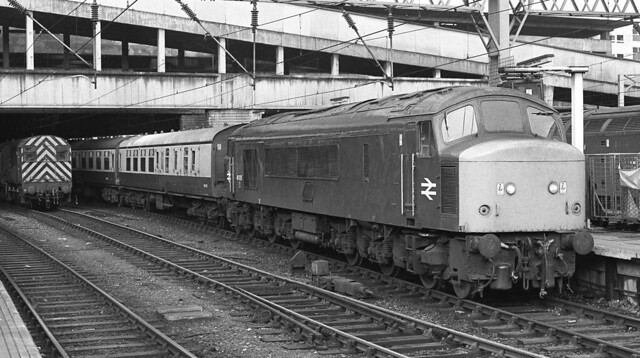 Class 46 46035 stands at Platform 10 at Birmingham New Street with I belive a Newcastle to Cardiff train.20/05/1977.