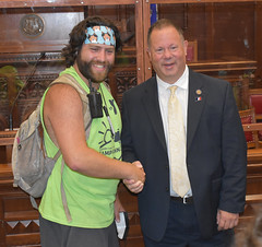 State Rep. Craig Fishbein shakes hands with a counselor from Cheshire's Camp Quinnipiac during their tour of the Capitol complex.