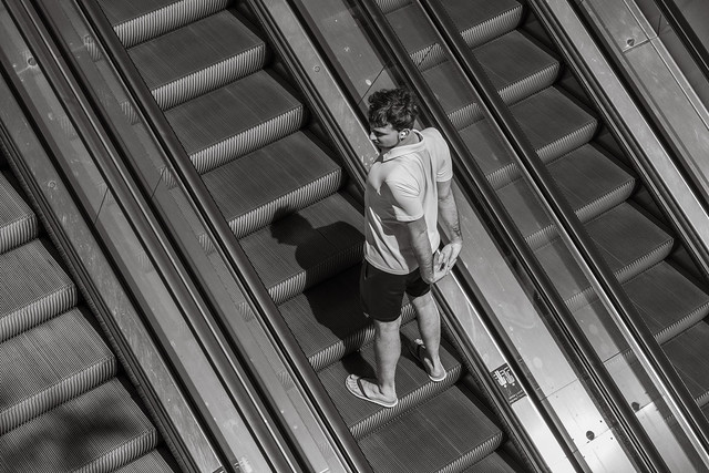 Stranger on moving stairs in Amsterdam