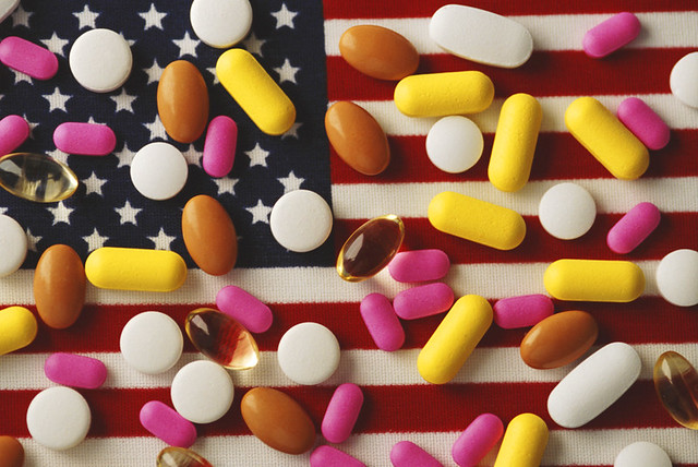 Pills on American flag with drug addiction exploding, killing people.