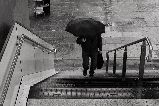 On the stairs with umbrella - Embankment, London