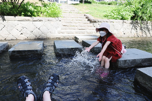 Sakiko plays in the water at Soseigawa river park.