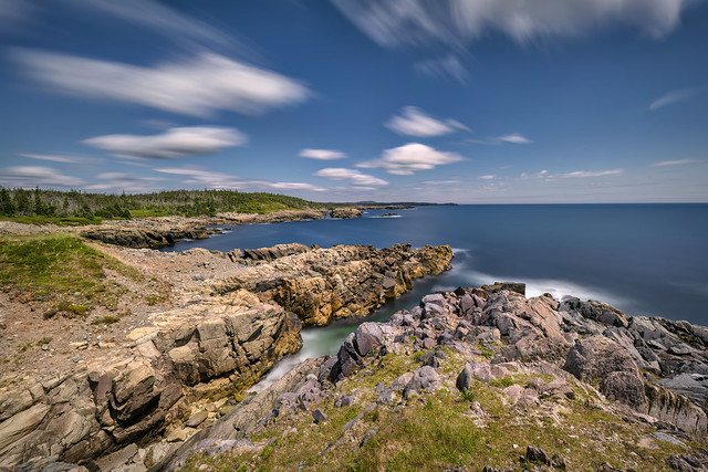 Long exposure of clouds and waves in the Atlantic Ocean from the Green Cove trailhead, Cabot Trail East side, Cape Breton Highlands National Park, Cape Breton Island, Nova Scotia, Canada