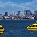 Skyline of Manhattan with water taxis in foreground, New York, March 14, 2012