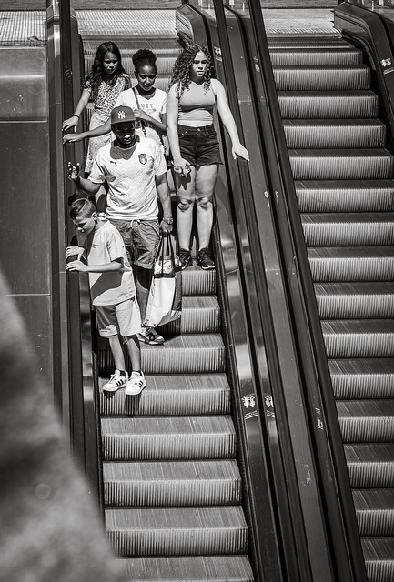 Family on moving stairs in Amsterdam