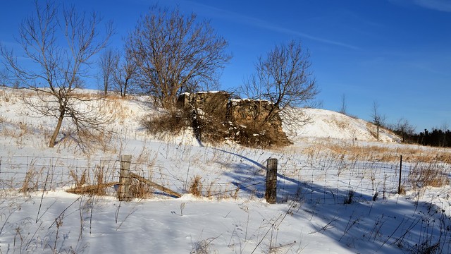 Winter landscape with fieldstone foundation ruins, Caledon, Ontario.