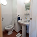 En suites include a toilet, sink and mirror