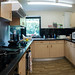 Fully equipped shared kitchen with lots of cupboard space