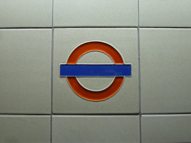 Roundel detail on Gants Hill London Underground Station wall tiling