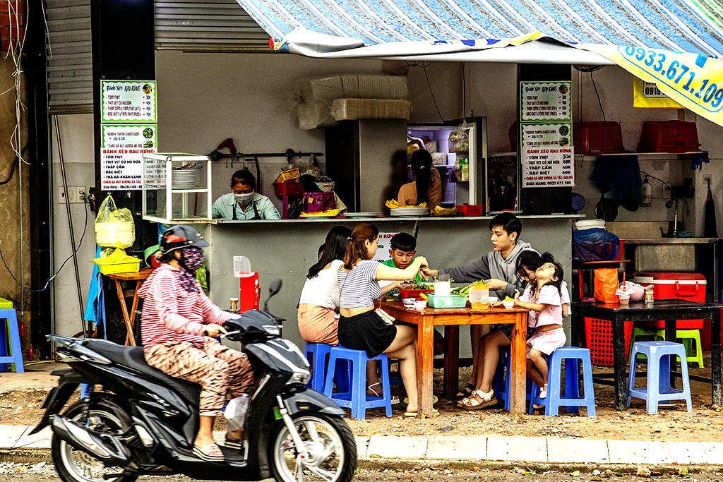 Family eating banh xeo outside on 8-9-22--Vung Tau copy