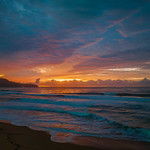 11. August 2022 - 6:09 - Sunrise seascape with colourful cloud covered sky at Killcare Beach on the Central Coast, NSW, Australia.