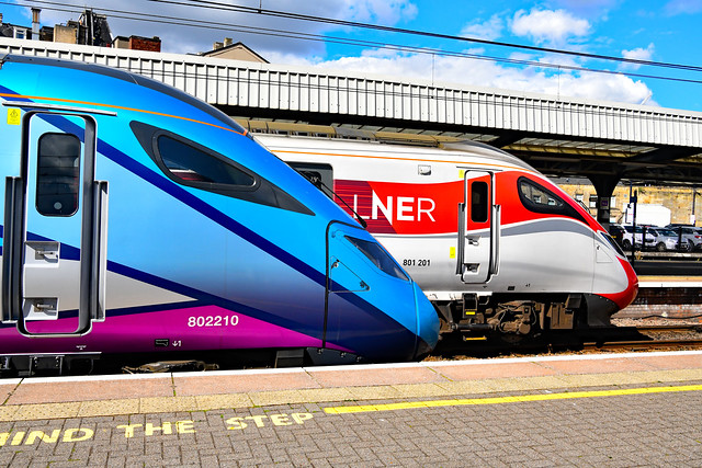 LNER 801201 & Transpennine Express 802210 stand and wait departure from Newcastle Central Station on the 4 August 2022.