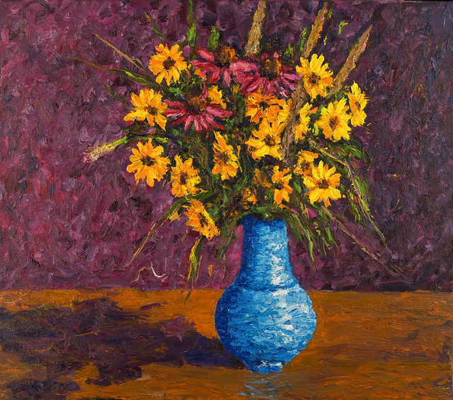 Bouquet of wild flowers in a blue vase