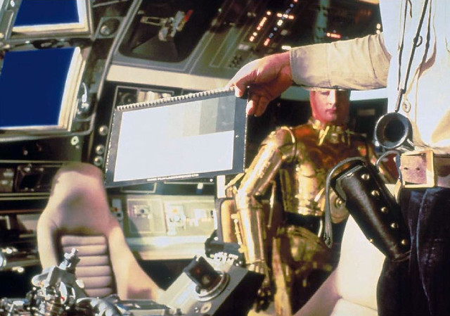 Anthony Daniels preparing for a shot in the Millennium Falcon cockpit for The Empire Strikes Back (1980)