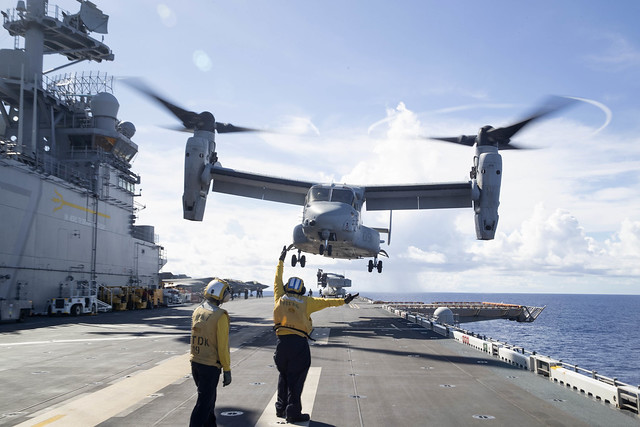 USS Tripoli (LHA 7) conducts flight operations in the Philippine Sea.