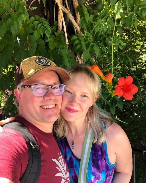 It was around 90 degrees in Leavenworth, and I immediately made a beeline for a shaded gazebo, covered in flowers. We passed right by a cluster of flamboyant gays who were also posing by the flowers. “Yes!” I shouted appreciatively. 🌈:cherry_bloss
