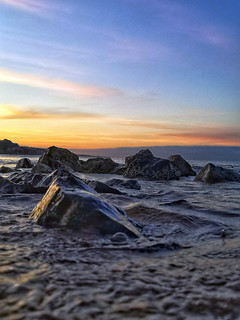 Sunset beach stones submerged