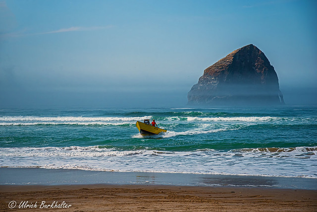 Incoming Dory at Haystack Rock in Pacific City, Oregon.