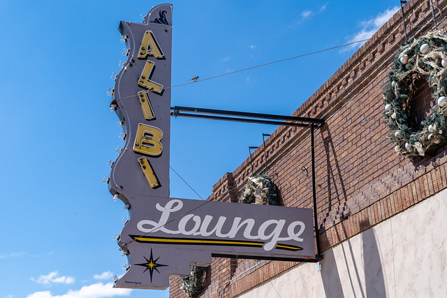 Shelby, Montana - July 2, 2022: Vintage retro neon sign for hte Alibi Lounge in the downtown area