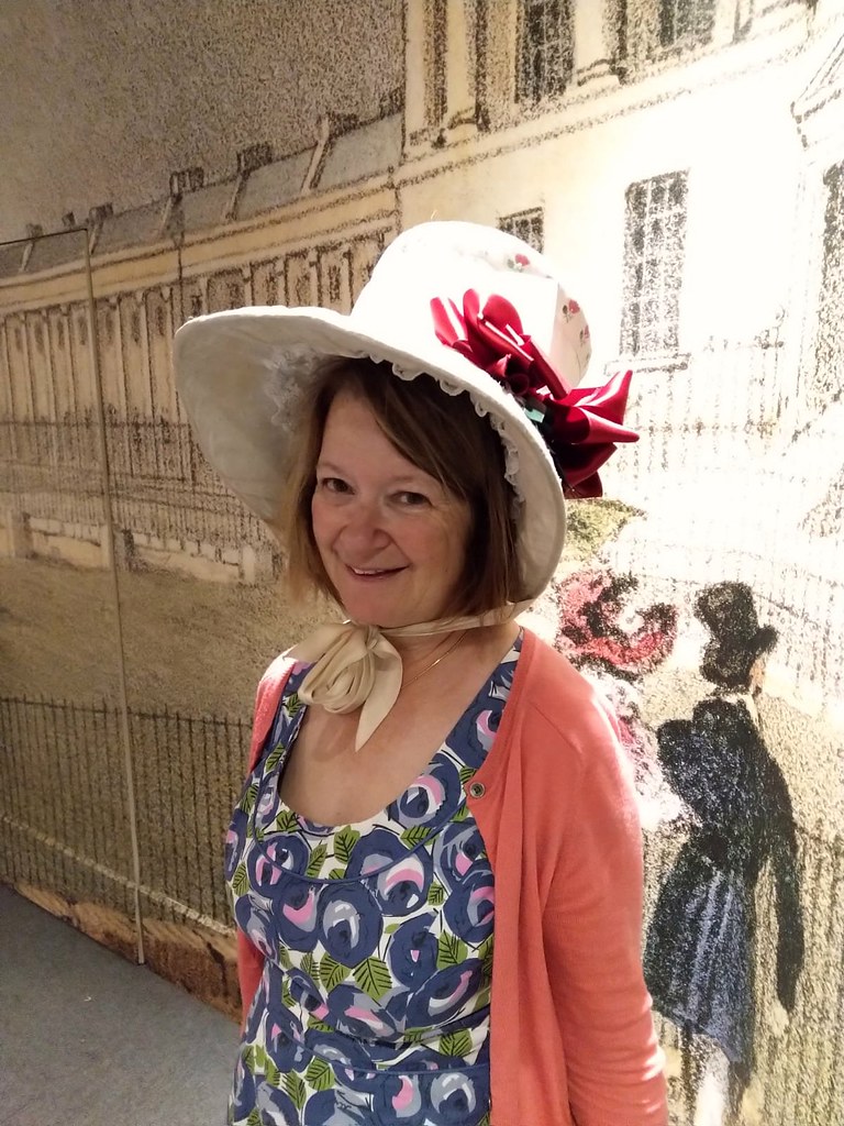 Wearing one of the bonnets at The Fashion Museum, Bath
