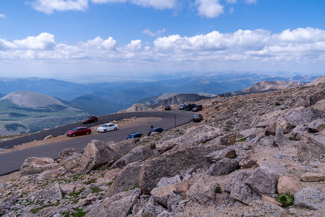 Colorado, USA - July 29, 2021: Cars parked along the side of the road along Mount Evans, a 14er mountain in the Arapaho and Roosevelt National Forest