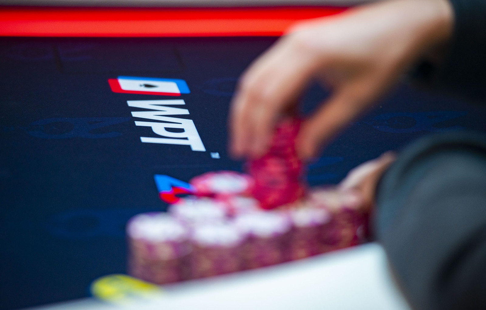 Poker Chips in Front of WPT Logo