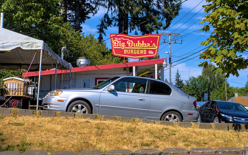 Big Bubba's Burgers: Where the big SR-3 sign with Washington eating a burger is located.