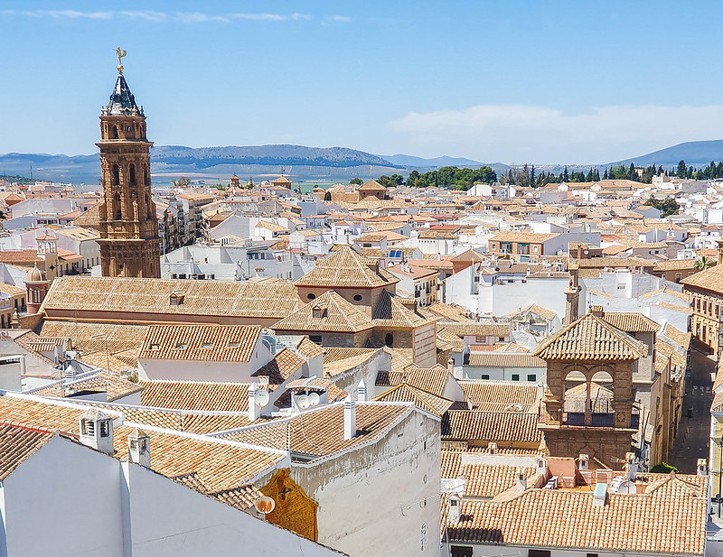 A panoramic view of Antequera. The photo was taken from above and you can see many of the orange rooftops of the city.