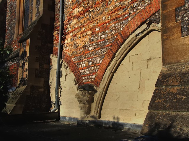 Roman brick and local flint - demolished cloister arch, St Albans Cathedral, St Albans, Herts, England.