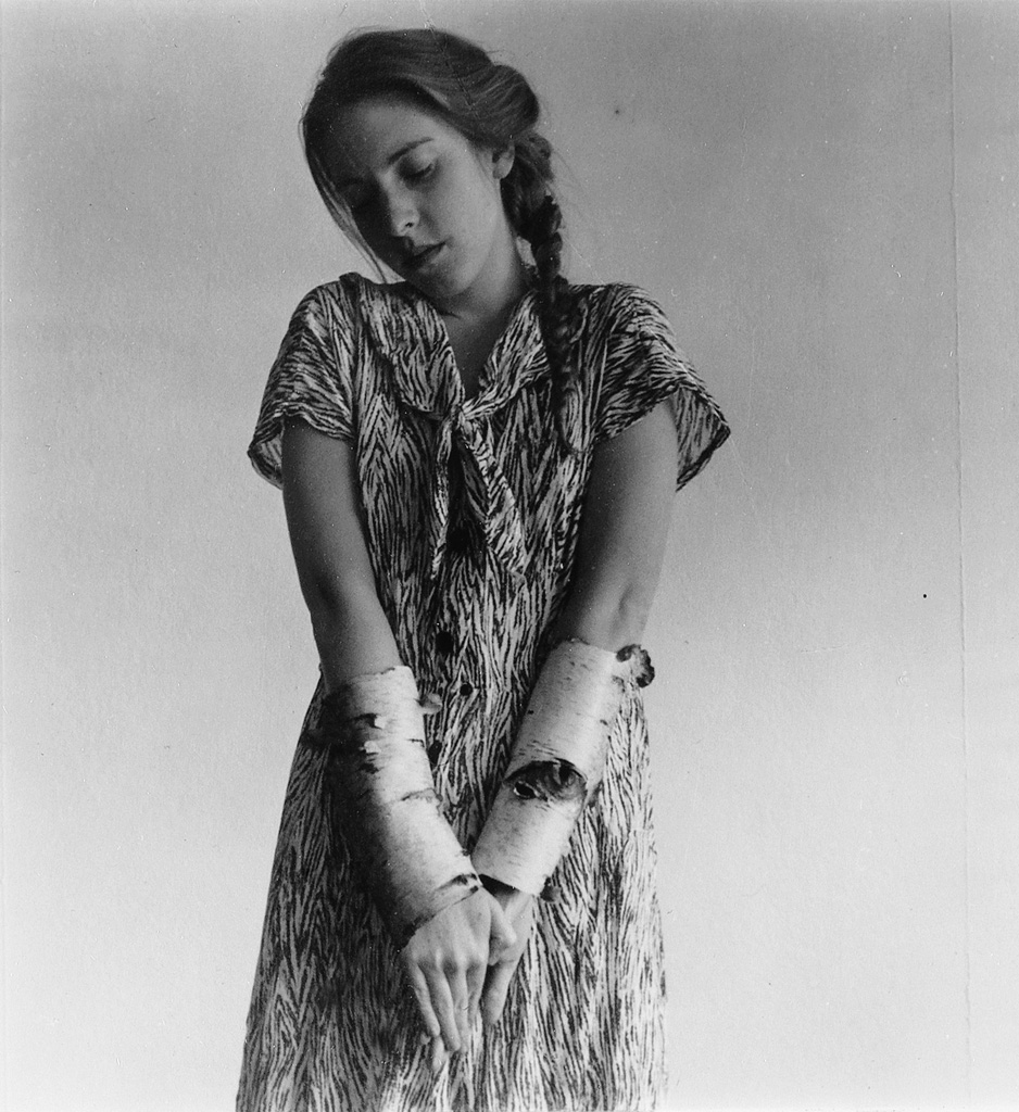Francesca Woodman (1958-1981) :: Self-portrait, birch sleeves. Silver print. | Swann Galleries