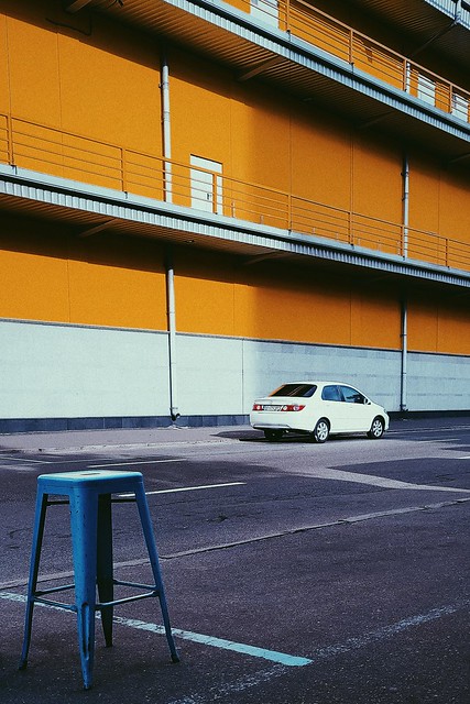 white car yellow wall