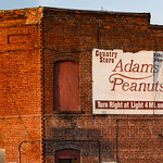 Turn Right on 460 than four miles to Adams Peanuts Turn Right than Four Miles to Adams Peanuts  - Adams Peanuts Sign on Building in Waverly, VA