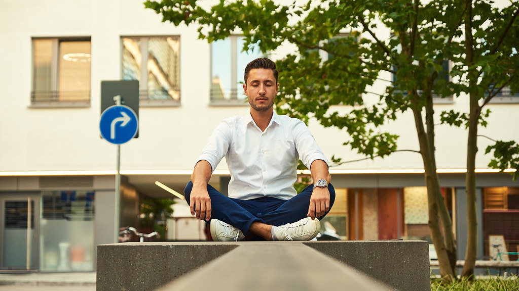 Man sits in lotus position