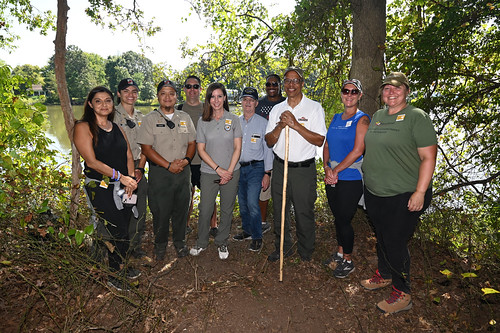 Photo of group of people on a trail in the woods