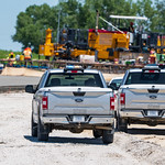 LSB Construction - June 22nd, 2022 Nebraska DOT inspectors parked near NE-2 mainline paving operations in the east interchange area.