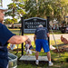 RiverDogs help beautify the grounds of Park Circle Ceramics in preparation for its opening next month.