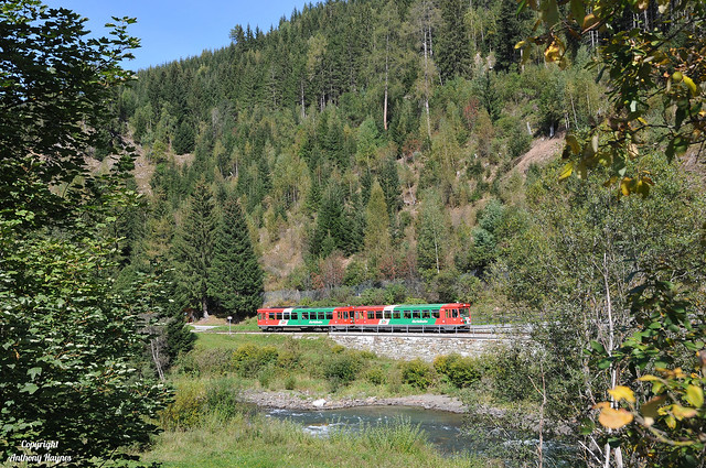 An STLB two car DMU rolls down the Mur river valley towards Madling on the Murtalbahn.