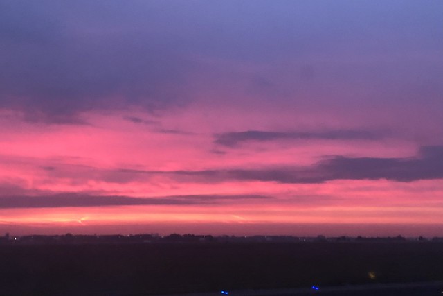 Sunrise sky upon landing at Amsterdam Schiphol Airport, Netherlands