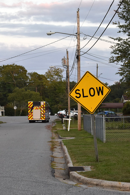 Fire Truck And Slow Sign.