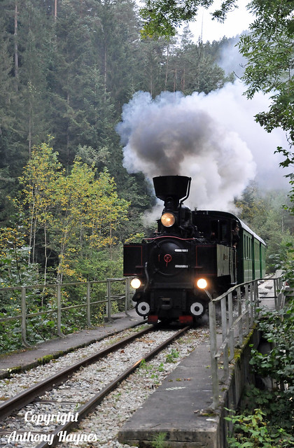 Steam locomotive No. U8 'Teufenbach' races across the Feistritz river viaduct on the Feistritztalbahn.