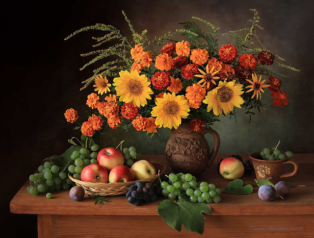Still life with a bouquet of marigolds and sunflowers