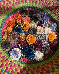 Making as many pompoms as possible. Bonus video of gratuitous slo-mo pompom shaking.