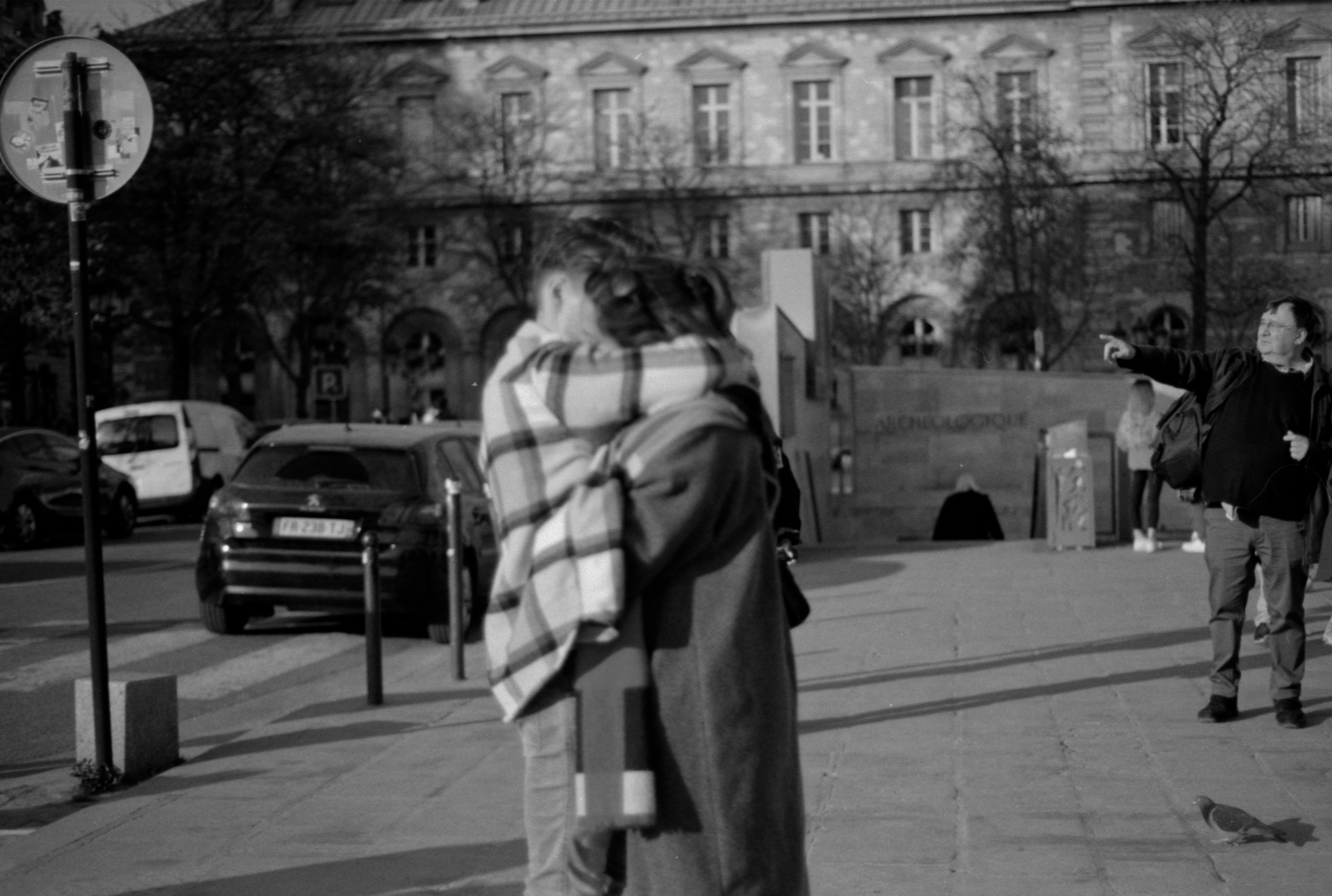 young couple hugging | wide image