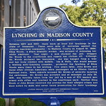 Lynching in Madison County and Lynching in America Historic Marker (Jackson, Tennessee) Historical marker about lynching in American and in Madison County on the courthouse grounds in Jackson, Tennessee.  The plaque states:

&amp;quot;Lynching in America - Thousands of African Americans were victims of lynching and racial violence in the United States between the Civil War and World War II. The lynching of African Americans during this era was a form of racial terrorism used to intimidate black people and enforce racial hierarchy and segregation. Lynching was most prevalent in the South. After the Civil War, violent resistance to equal rights for African Americans and an ideology of white supremacy led to fatal violence against black women, men and children accused of violating social customs, engaging in interracial relationships, or crimes. Community leaders who spoke out against this racial terror were themselves often targeted by violent mobs. Lynching became the most public and notorious form of racial terror and subordination directed at black people and was frequently tolerated or even supported by law enforcement and elected officials. Though terror lynching generally took place in communities with functioning criminal justice systems, lynching victims were denied due process, often based on mere accusations, and pulled from jails or delivered to mobs by law officers legally required to protect them. Millions of African Americans fled the South to escape the climate of terror and trauma created by these acts of violence. Of the more than 237 documented racial terror lynchings that took place in Tennessee between 1877 and 1950, at least three took place in Madison County. &amp;quot;

&amp;quot;Lynching in Madison County - Between 1877 and 1950, there were at least 237 lynchings in the state of Tennessee. These were acts of terrorism against the African American community. In Madison County on August 16, 1886, Eliza Woods, a black domestic worker, was accused of poisoning her white employer. That night, a mob stormed the jail, dragged Ms. Woods to the courthouse and ripped her clothes off. Although Ms. Woods declared her innocence, she was hanged from a tree and her body riddled with bullets. Ida B. Wells, who would become a leading anti-lynching crusader, protested the lynching of Eliza Woods many times in her writing. Five years later, John Brown and three other African Americans were passengers on an Illinois Central Railroad train. News reports accused Mr. Brown of severely injuring the switchman. Mr. Brown was arrested and at midnight on July 26, 1891, was forcibly taken from the jail by a mob of 500 masked men armed with rifles and lynched in the courthouse yard. Neither Eliza Woods or John Brown received due process for their alleged crimes and were killed by mobs who never faced prosecution for their lynchings.&amp;quot;