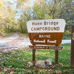 Hune Bridge Campground Sign Hune Bridge Campground is a small campground in the national forest&#039;s Marietta Unit. It sits next to the Little Muskingum River and the Hune Covered Bridge.

Forest Service photo by Kyle Brooks