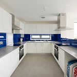 Bright shared kitchen with all appliances